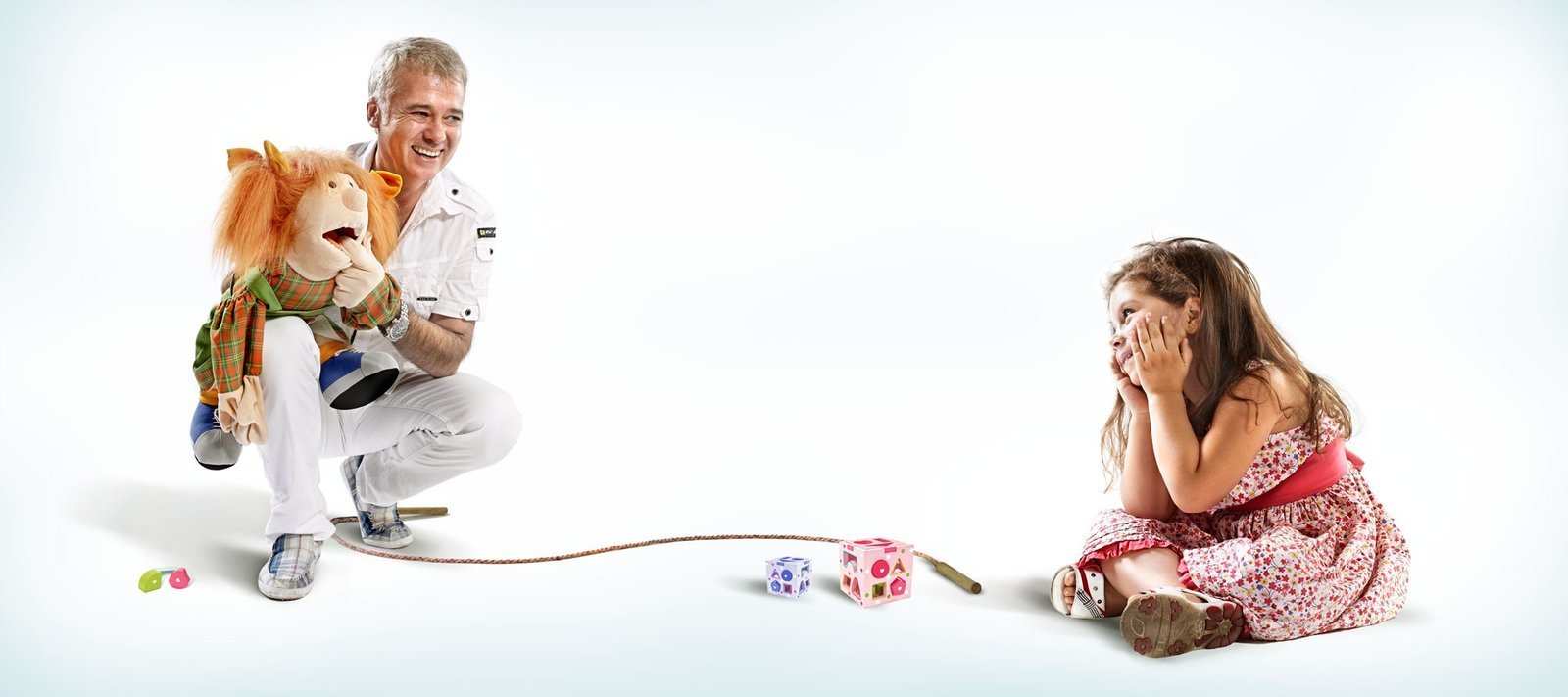 Dentist using a puppet to reassure a young patient